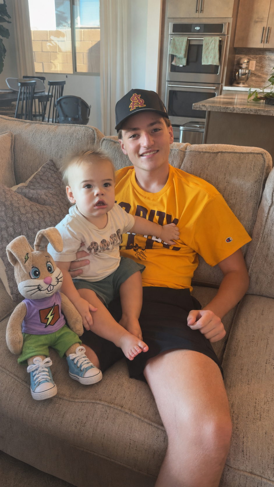 Holding Carter and OG Bunny together on the couch